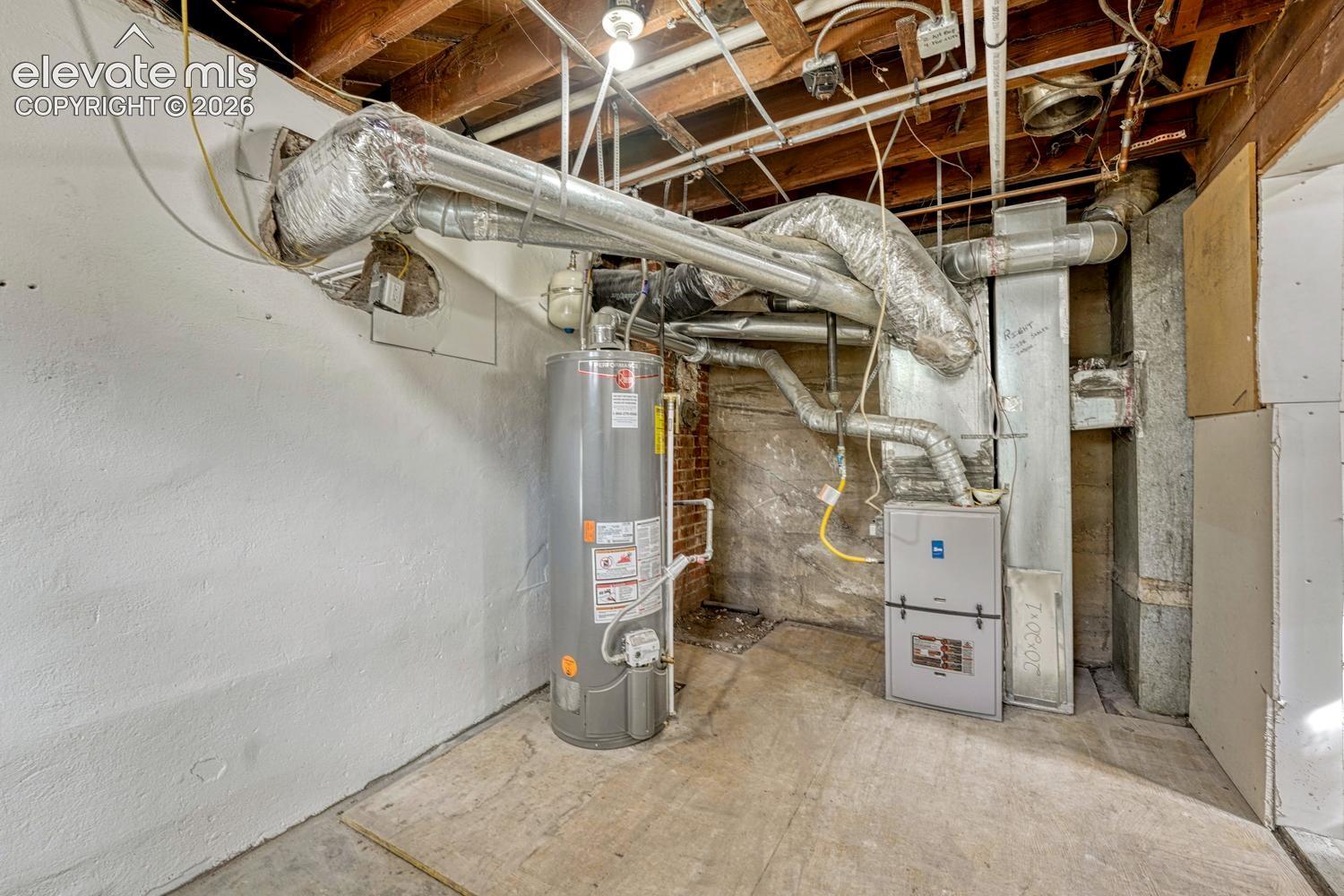 Exposed ceiling joists, water heater, and HVAC system