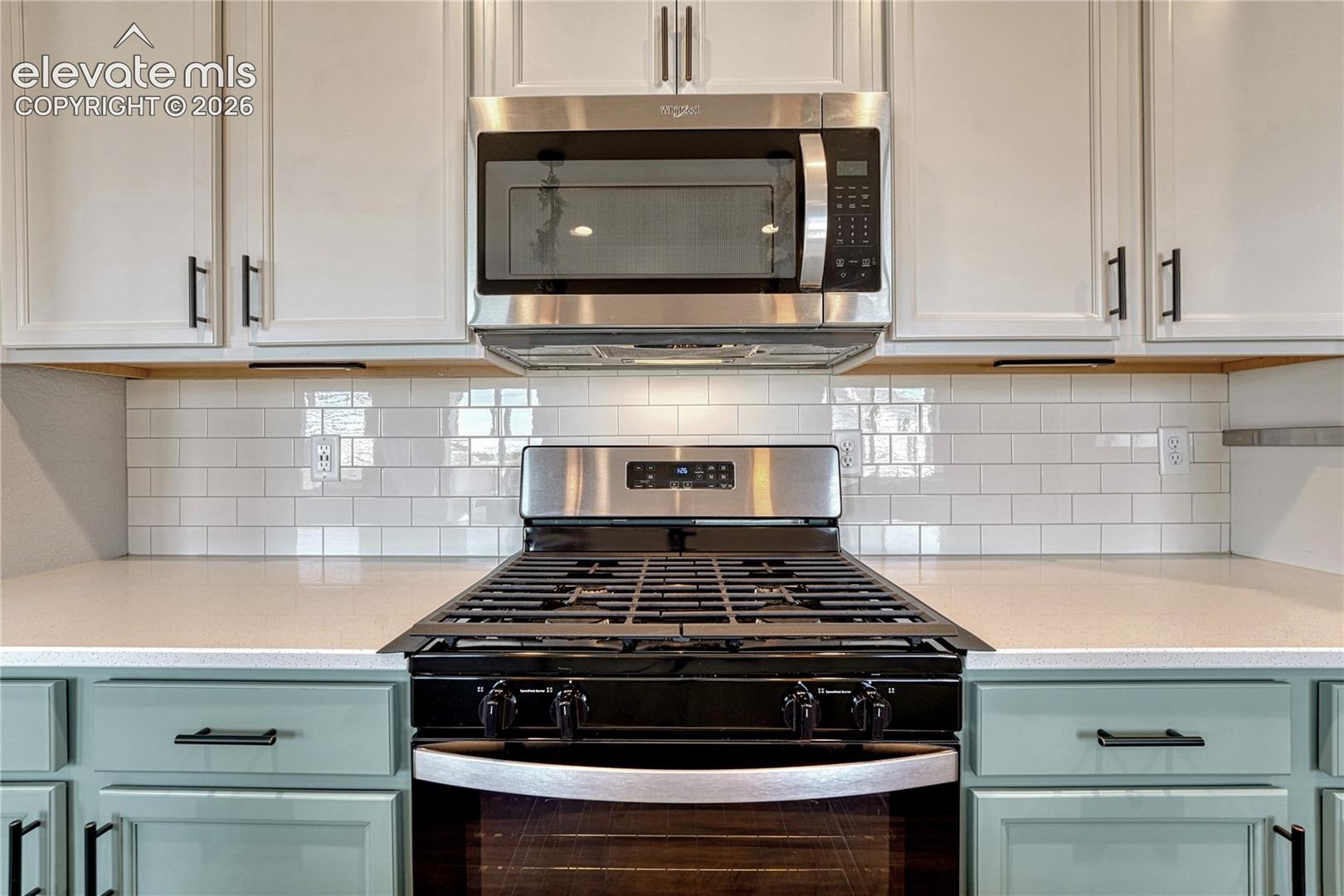 ...quartz countertops and gas range. 