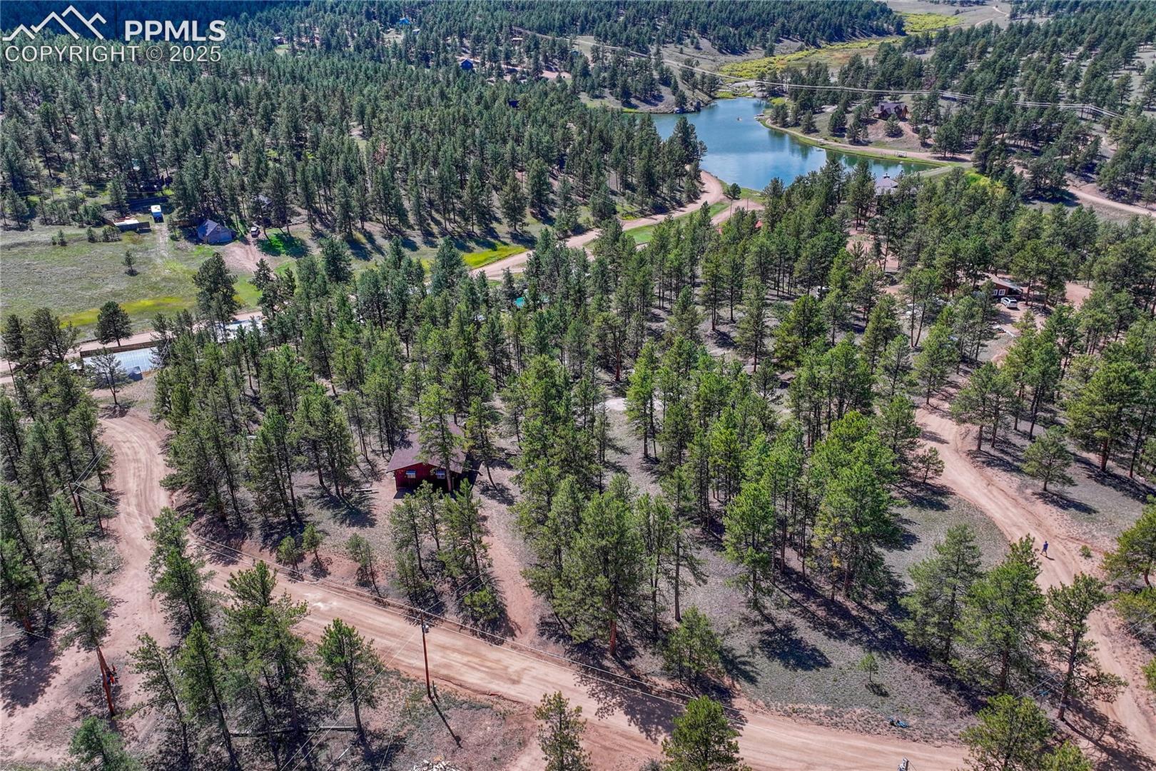 aerial view of home near lake for fishing with membership in the sportsman association