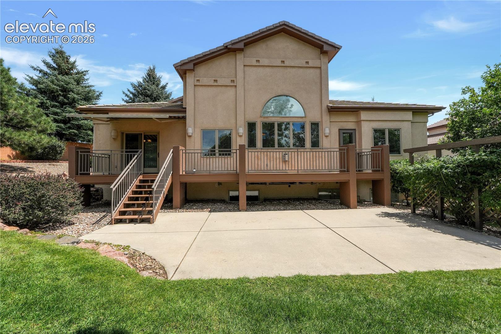 Large patio with mature landscaping 