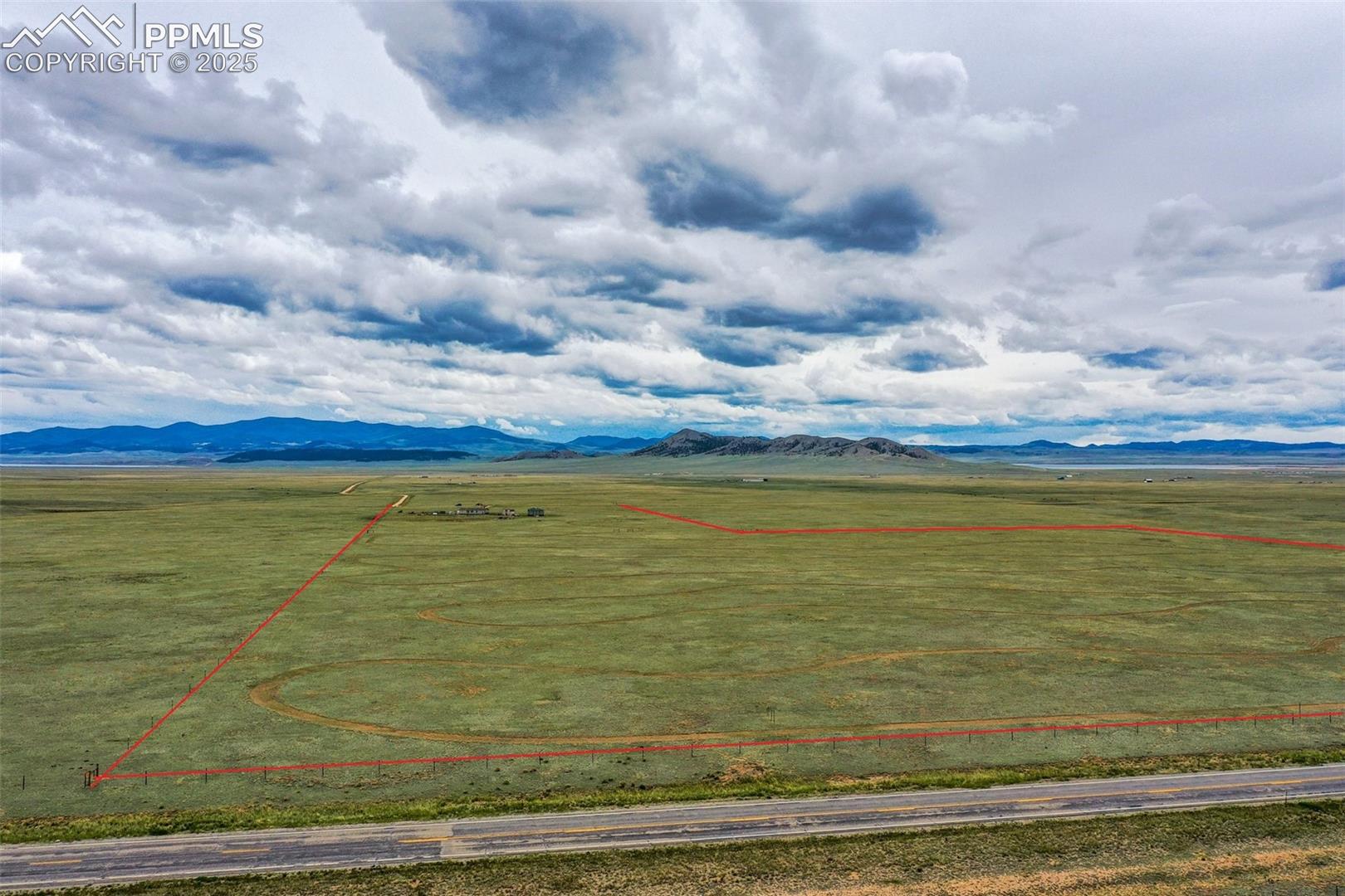 mountains and property parcel outlined. Mountain Views to the south. See additional red line lot line overlays. "Property Lines are Approximate and not a survey"