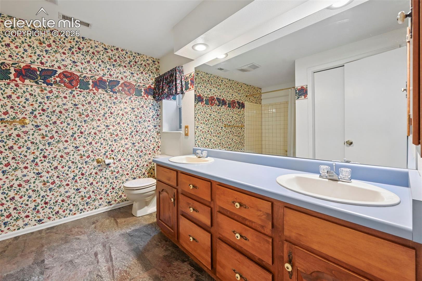 Full bath downstairs with tub/shower and double vanities.