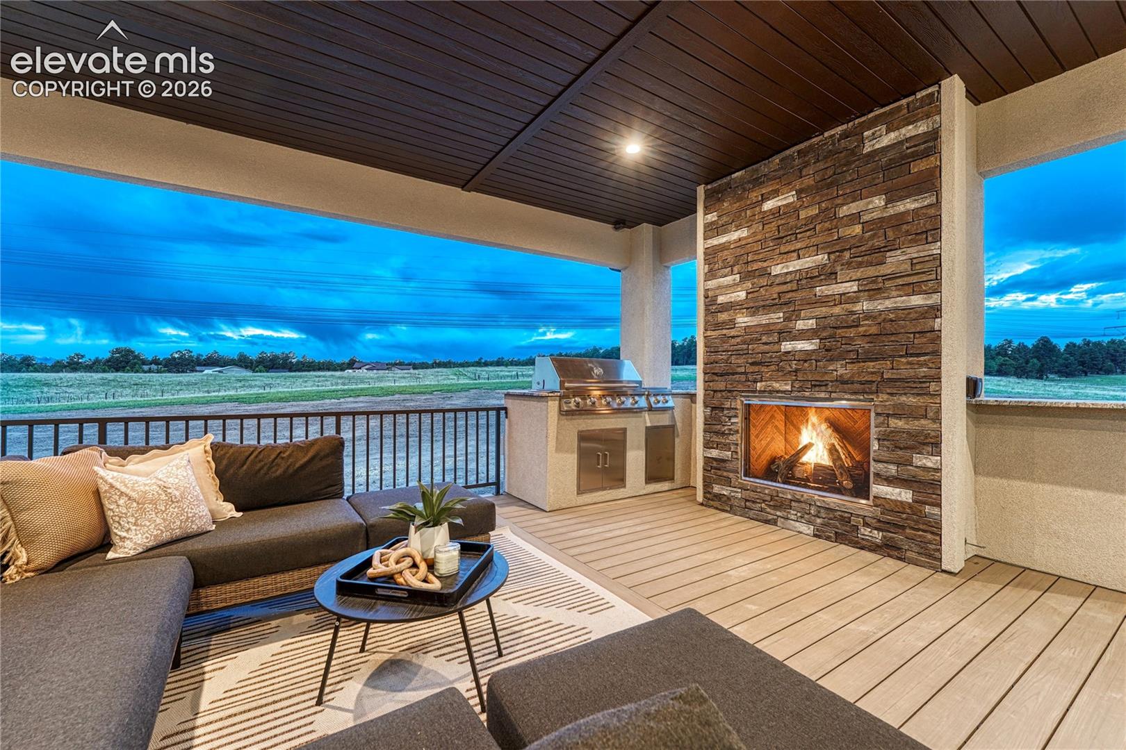 ...to the expansive covered composite deck with gas fireplace.