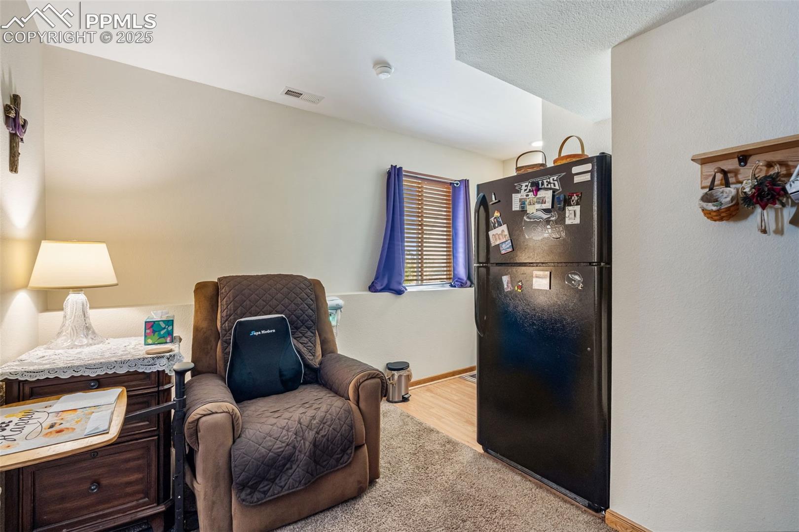 Cozy sitting area with kitchenette in suite