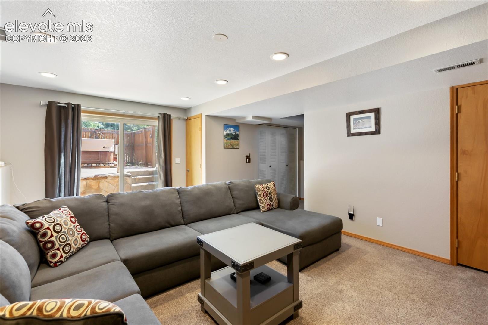 Walk out basement to hot tub and family room.