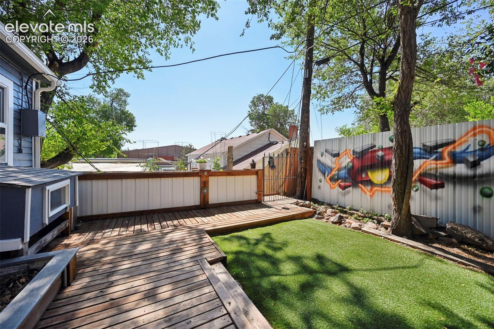 Boardwalk pathways to Raised Garden Bed and Flower Garden