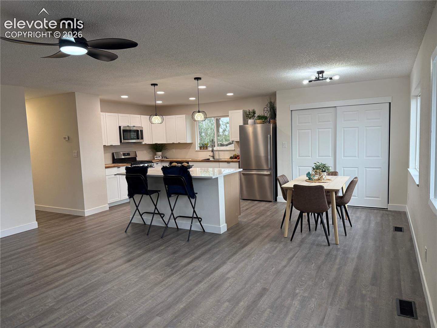 Beautifully renovated kitchen with2 tone cabinets and stainless steel appliances