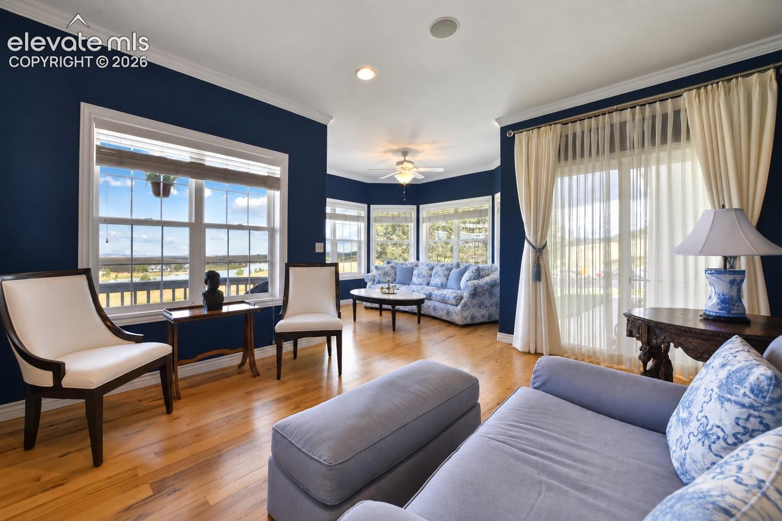 Formal living room with lake views, polygonal sitting area and walkout to front walkway!