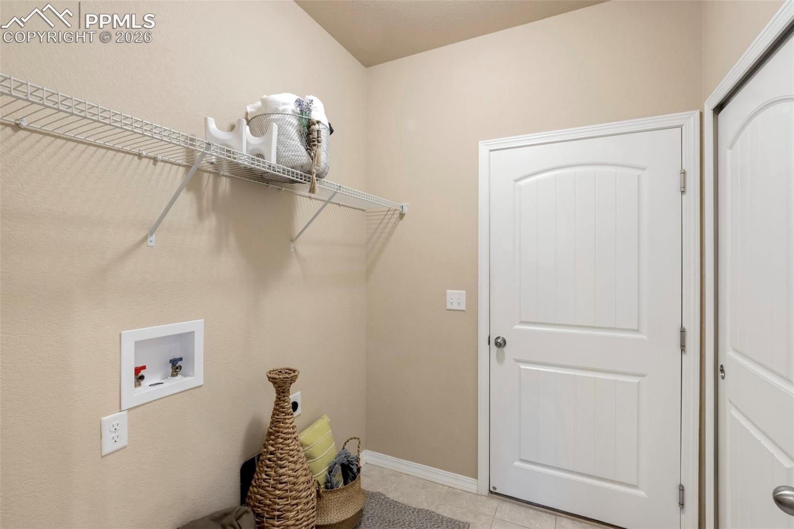 Main floor laundry and out to the 2-car garage.