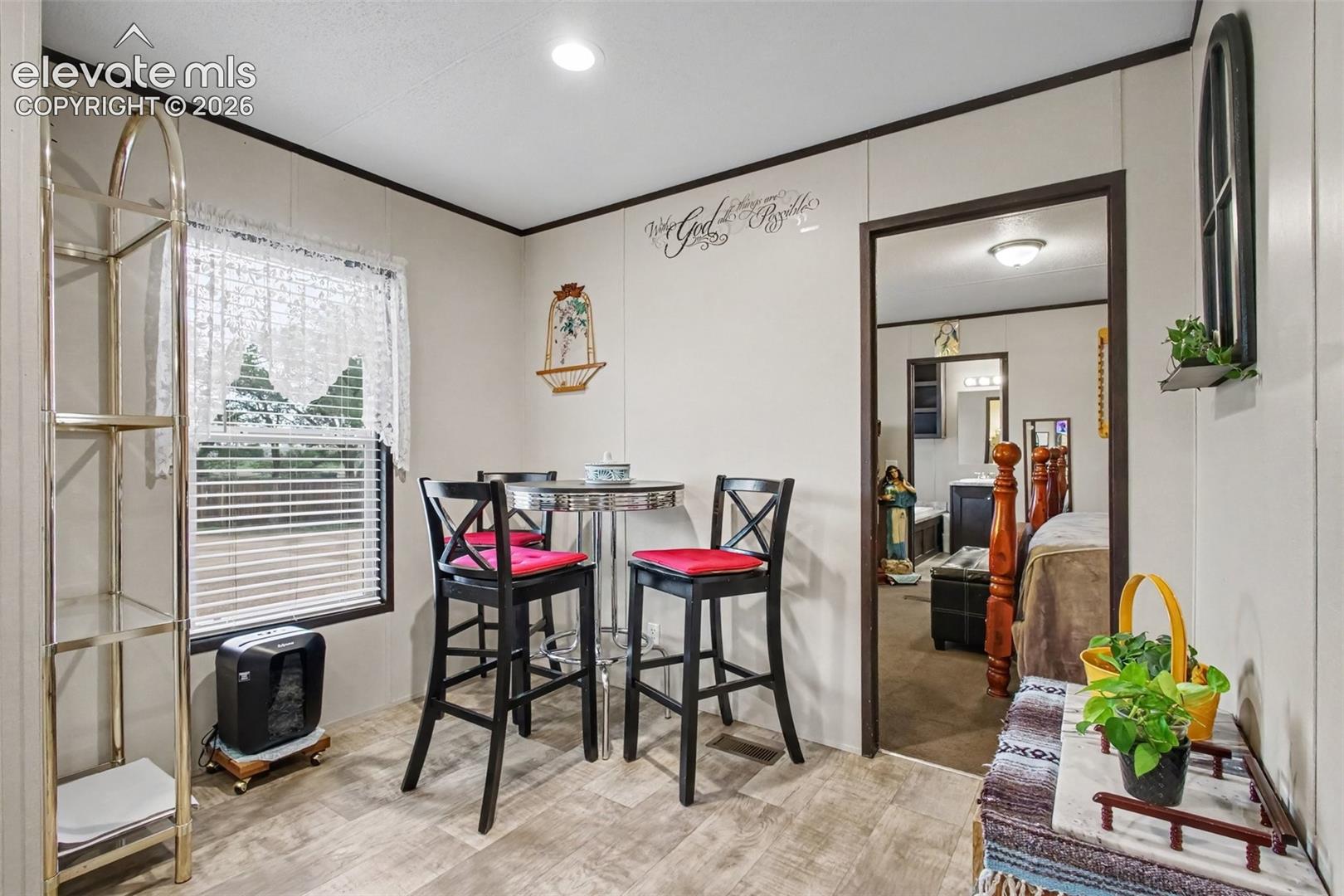 2nd Home: Bright and inviting dining area with an open layout, creating a comfortable space for family meals and gatherings.