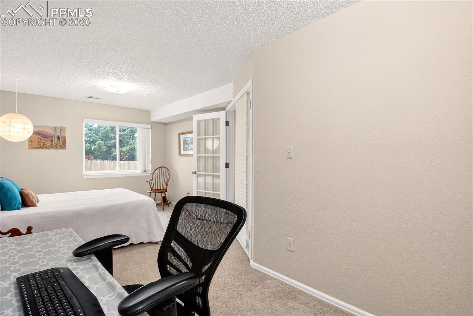 Versatile bedroom with enough room for a work or study area.