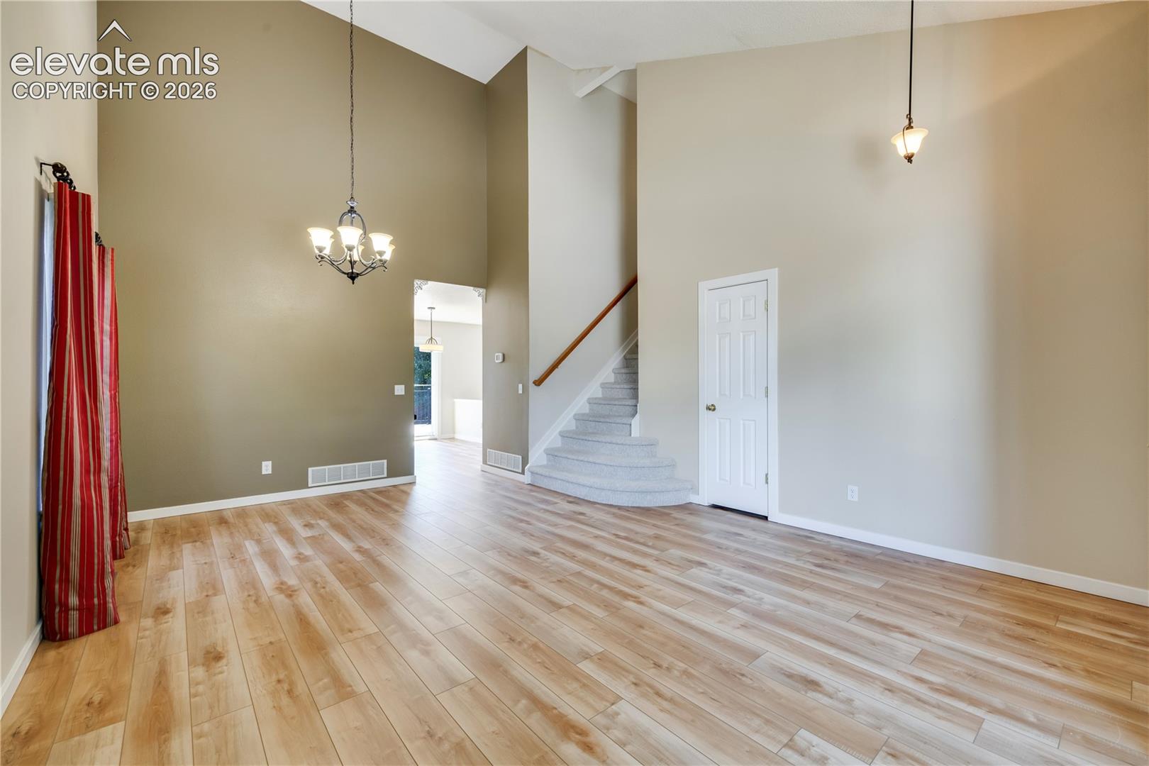 Formal living room has new luxury vinyl plank flooring