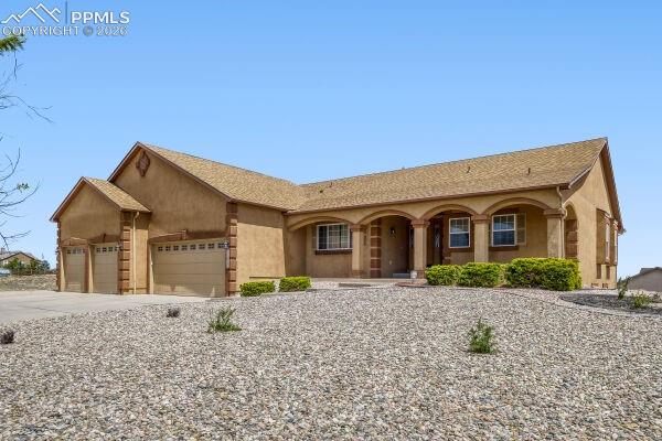 Stunning 5-bed, 3-bath ranch home in Meridian Ranch with vaulted ceilings, open floor plan, and incredible mountain views! Spacious kitchen with abundant storage opens to formal dining and a large living room with a gas fireplace. The spacious kitchen offers ample storage and functionality, a breakfast nook, and an easy flow into the formal dining area and the large living room with a cozy gas fireplace. The main-level primary suite supports true single-level living and includes a sitting area, a fireplace, a walk-in closet, and a luxurious 5-piece bath. The large finished basement provides two additional bedrooms, a full bathroom, a huge family room, and extra storage. Outdoor living shines with a covered front porch, expansive covered composite deck, professionally landscaped yard, and multiple access points for seamless indoor/outdoor entertaining. Dream oversized six-car garage offers incredible space for vehicles, toys, storage, or workshop needs. Rare opportunity to own a spacious home with incredible views and exceptional indoor/outdoor living!