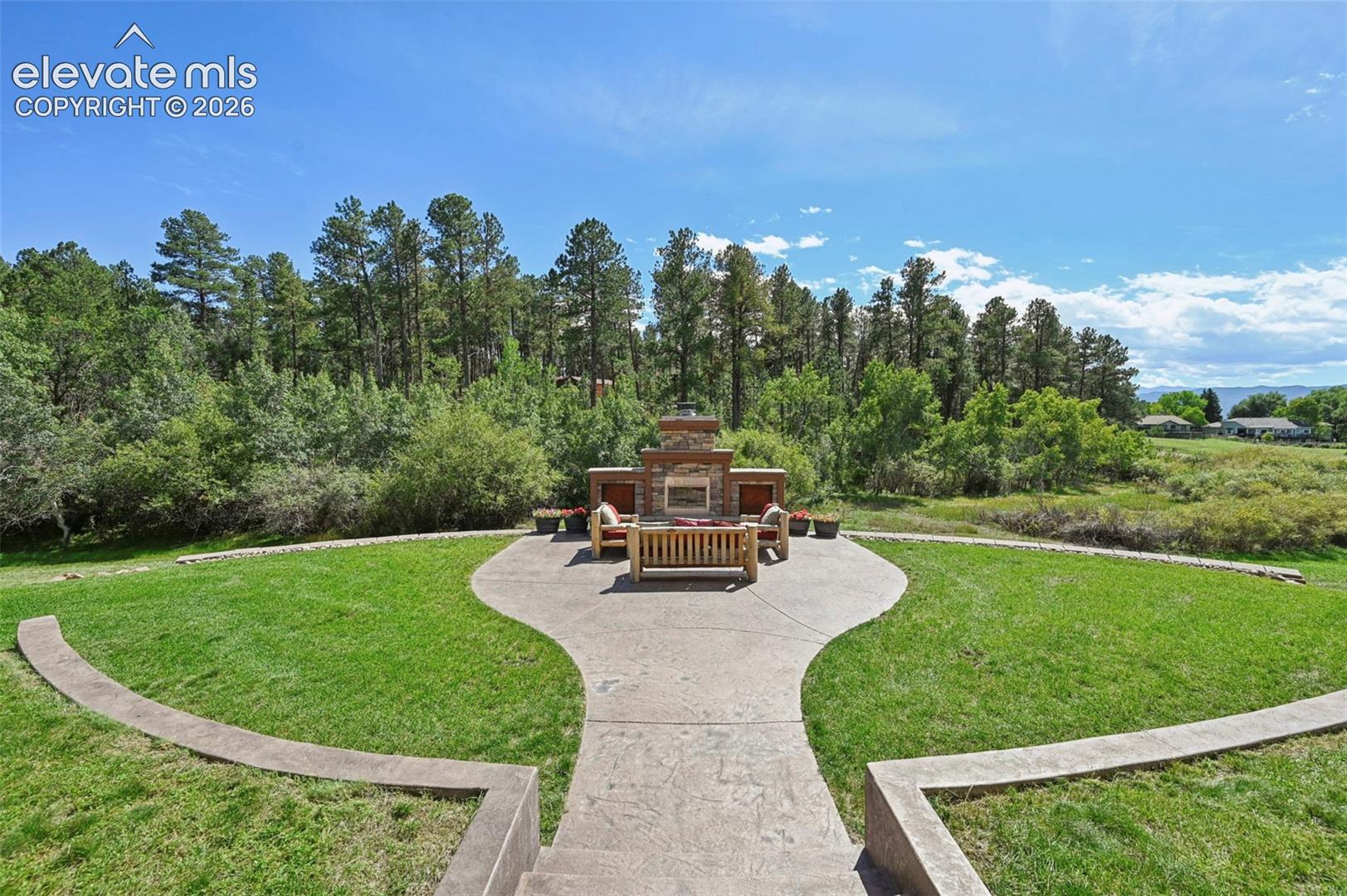 Outdoor fireplace and lawn - perfect for entertaining!