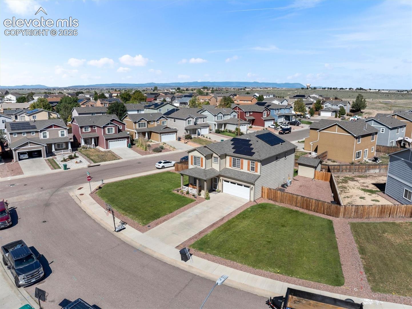 Two-story residence with a covered front porch and an attached two-car garage
