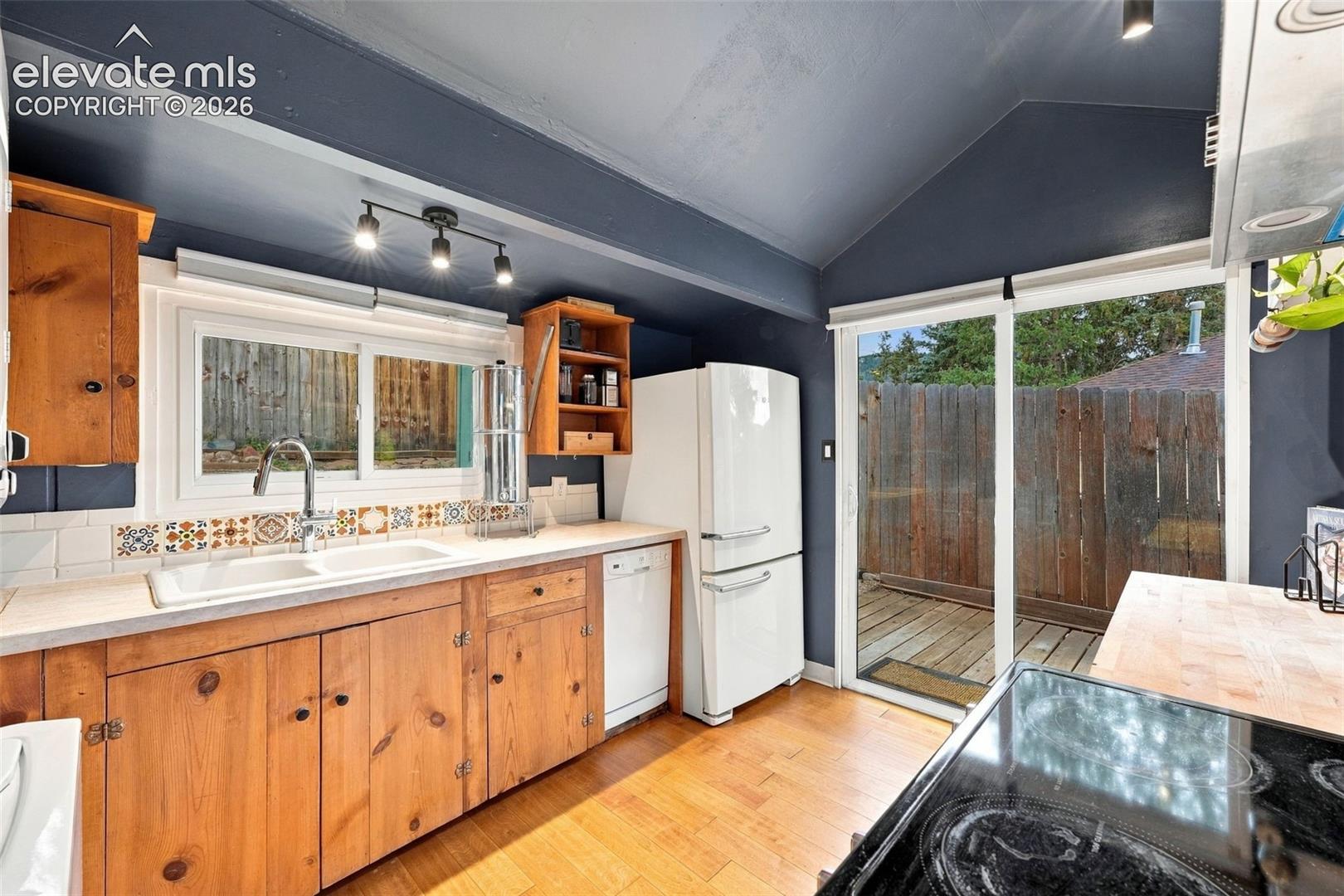 Kitchen featuring sliding glass door to the backyard.