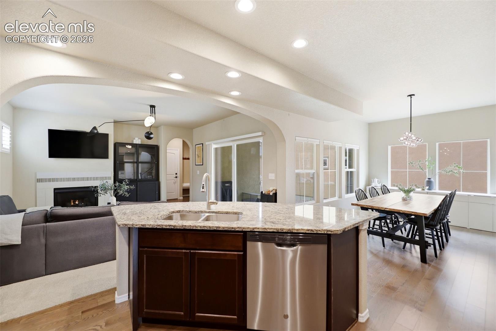 Open concept floorplan with a slider leading out to the covered side porch
