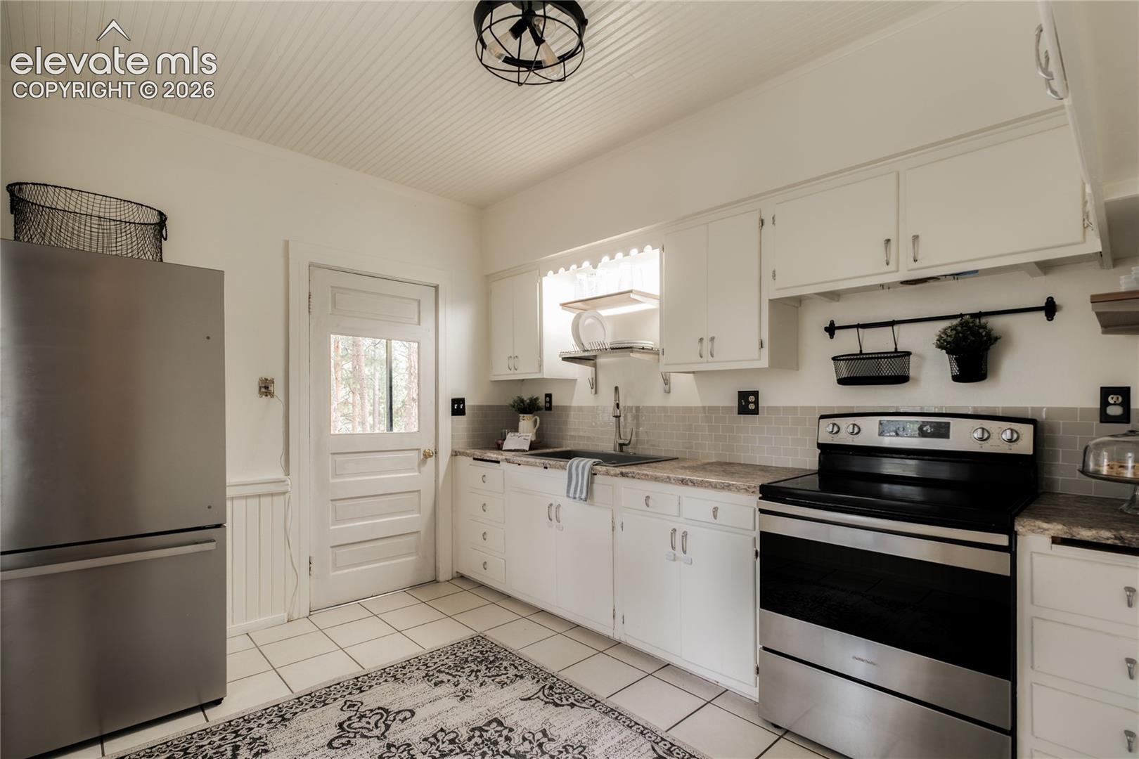 Stainless appliances and tile floors in the spacious kitchen!