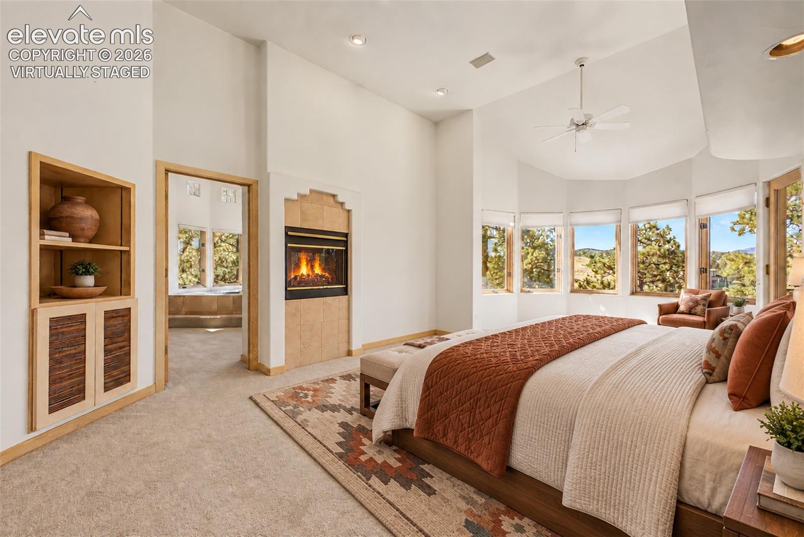 Virtually Staged
Built-in shelving, tiled fireplace, vaulted ceiling, bay window, and ceiling fan