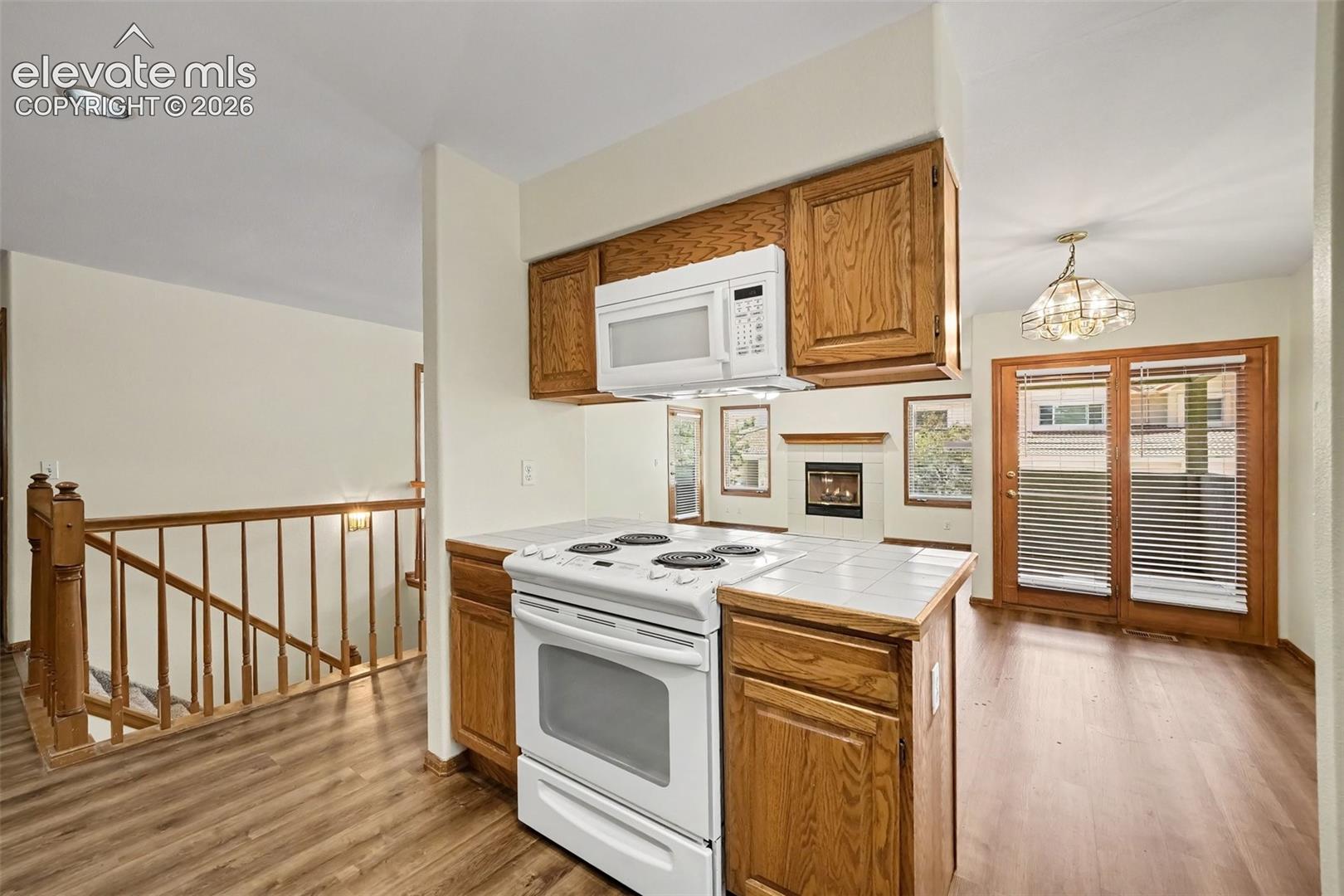 Kitchen featuring new LVP flooring and integrated microwave