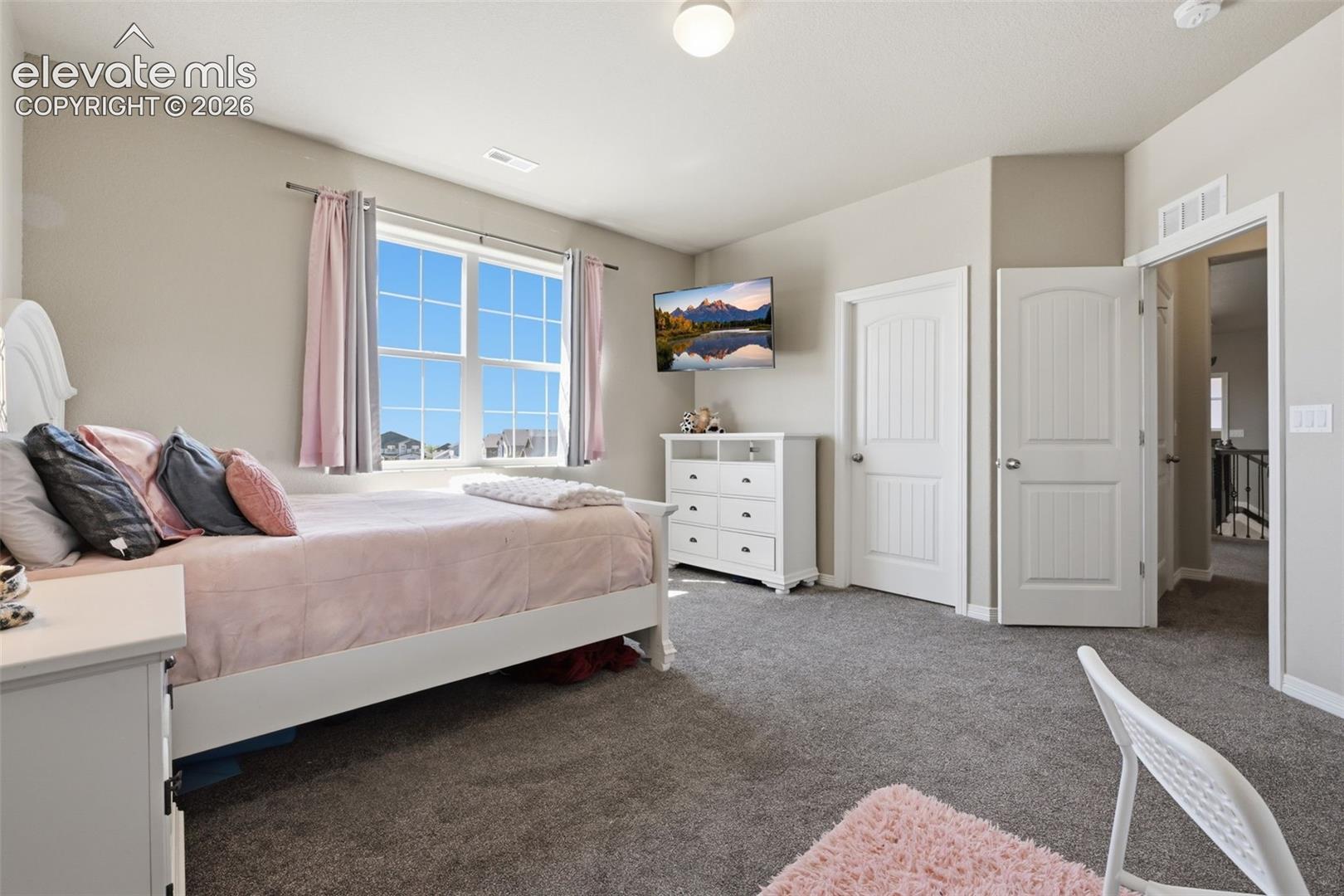 Upper-Level Secondary Bedroom with Walk-In Closet & Private Bath Access