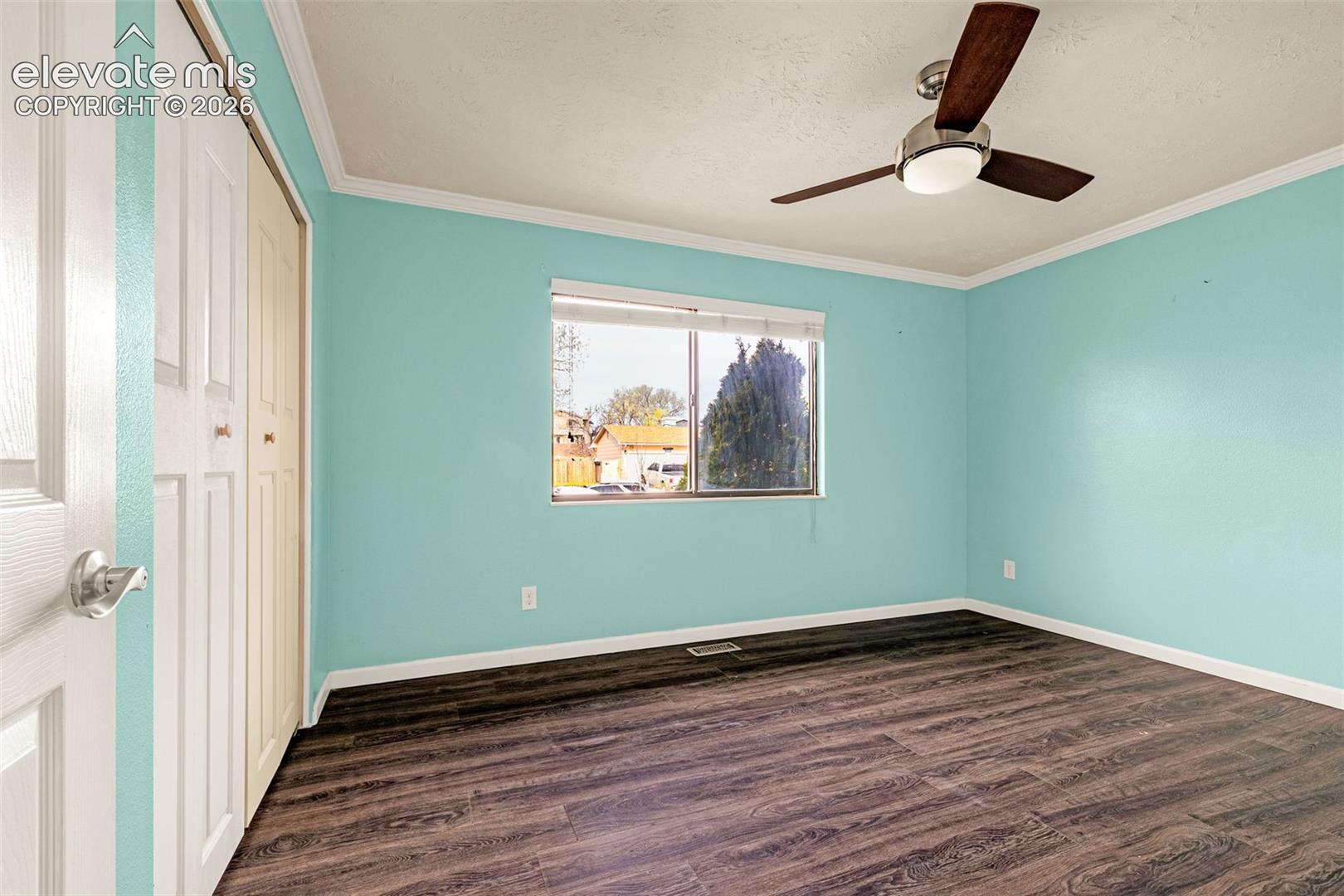 Primary bedroom with ceiling fan