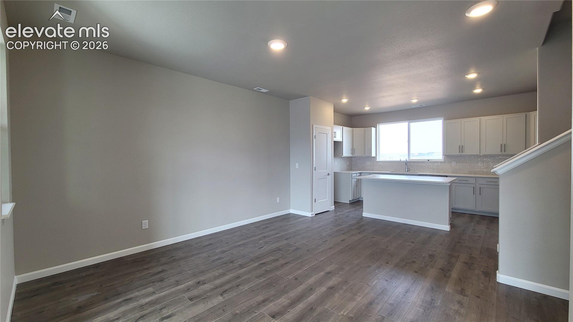 Dining area with LVP flooring, ready to host! 