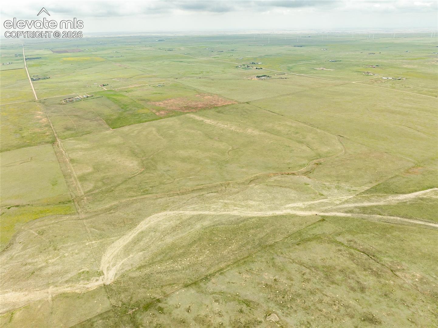 Expansive acreage featuring vast open plains, open pastureland, and established dirt access roads