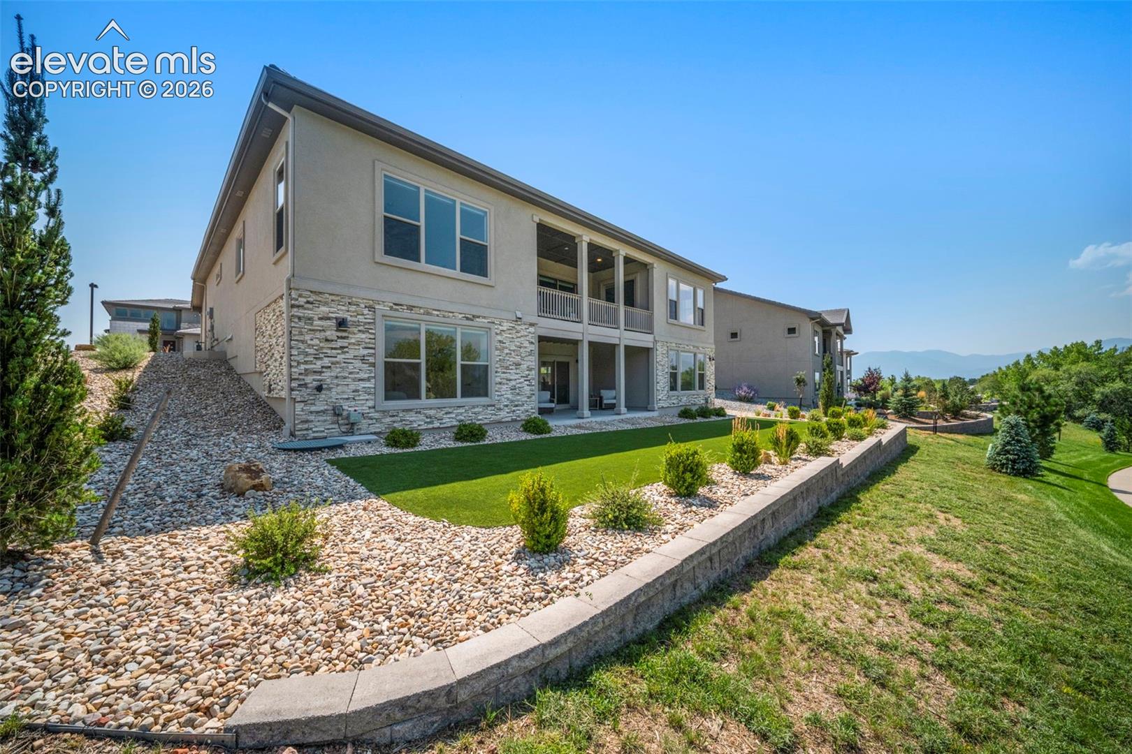 Low maintenace landscaping with spectacular mountain and Pikes Peak views