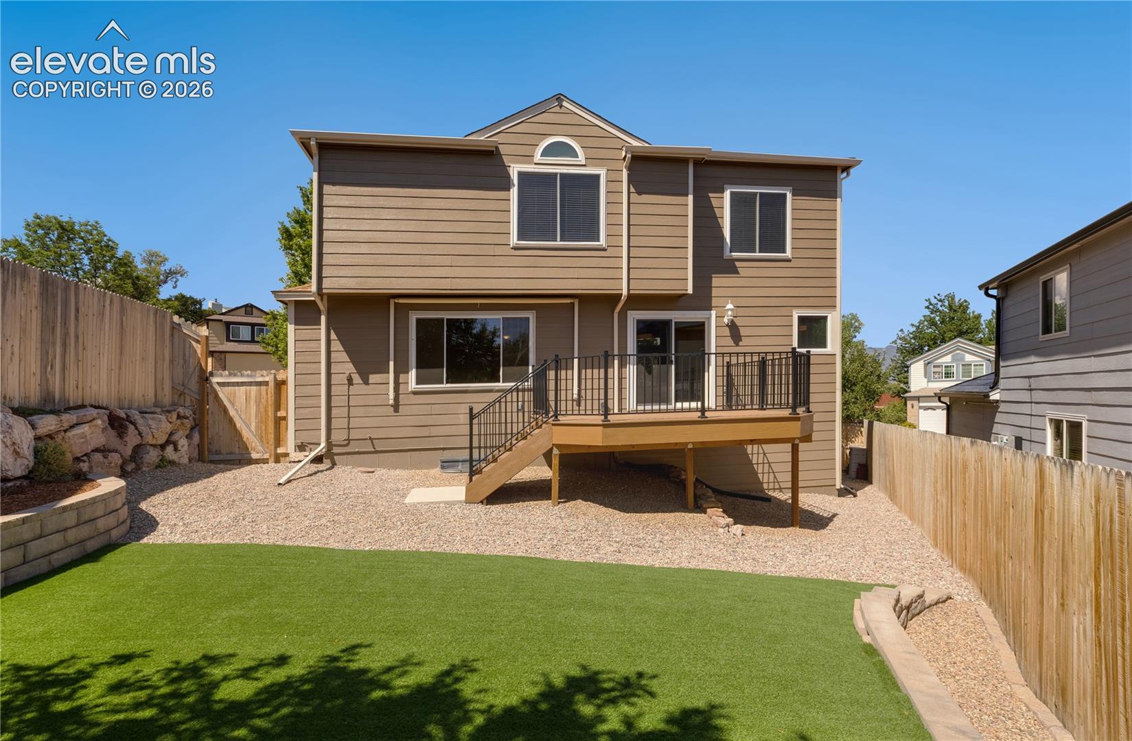 New landscaping in backyard and newer privacy fence