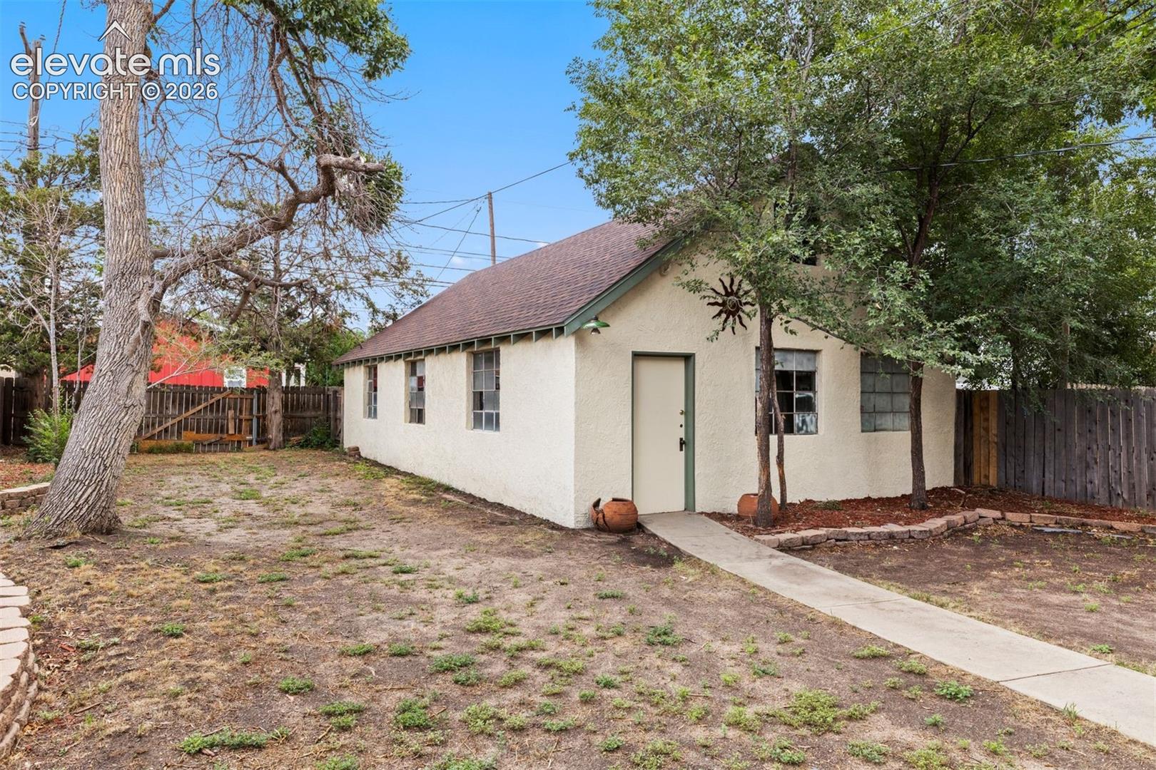 Back yard with garage