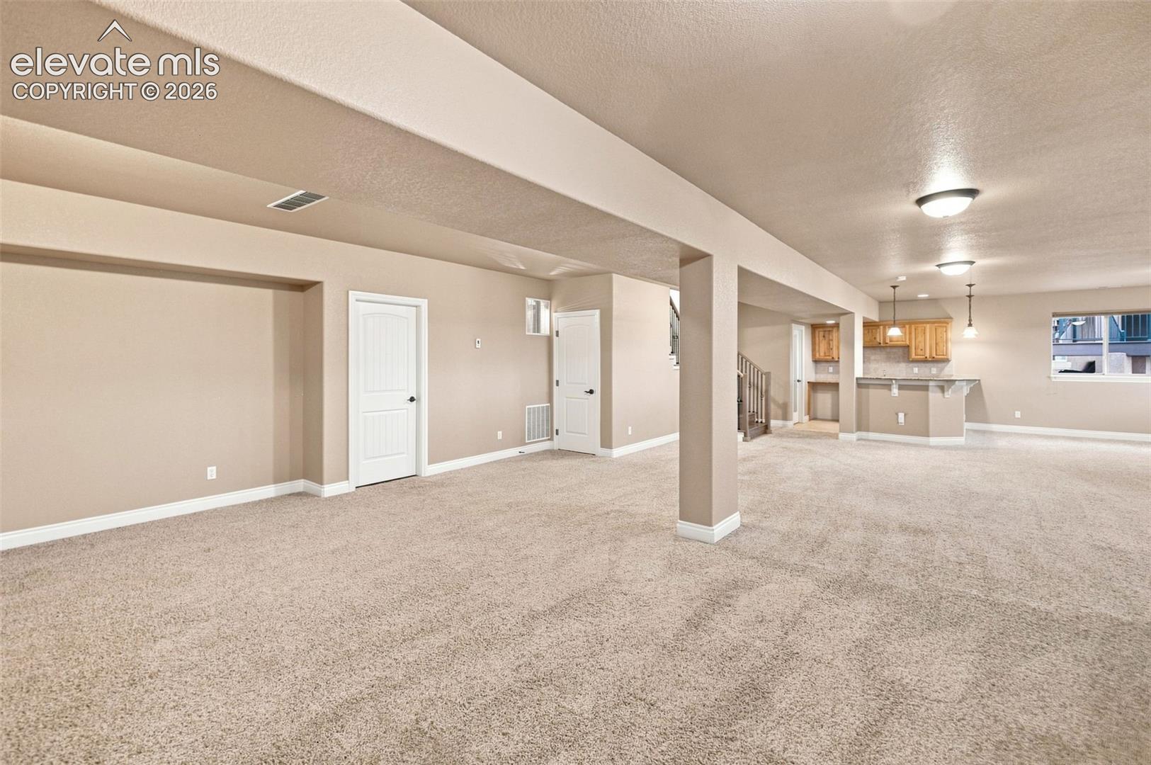 TV area - open to large great room baement w/ room for gaming and play! Walkout!!