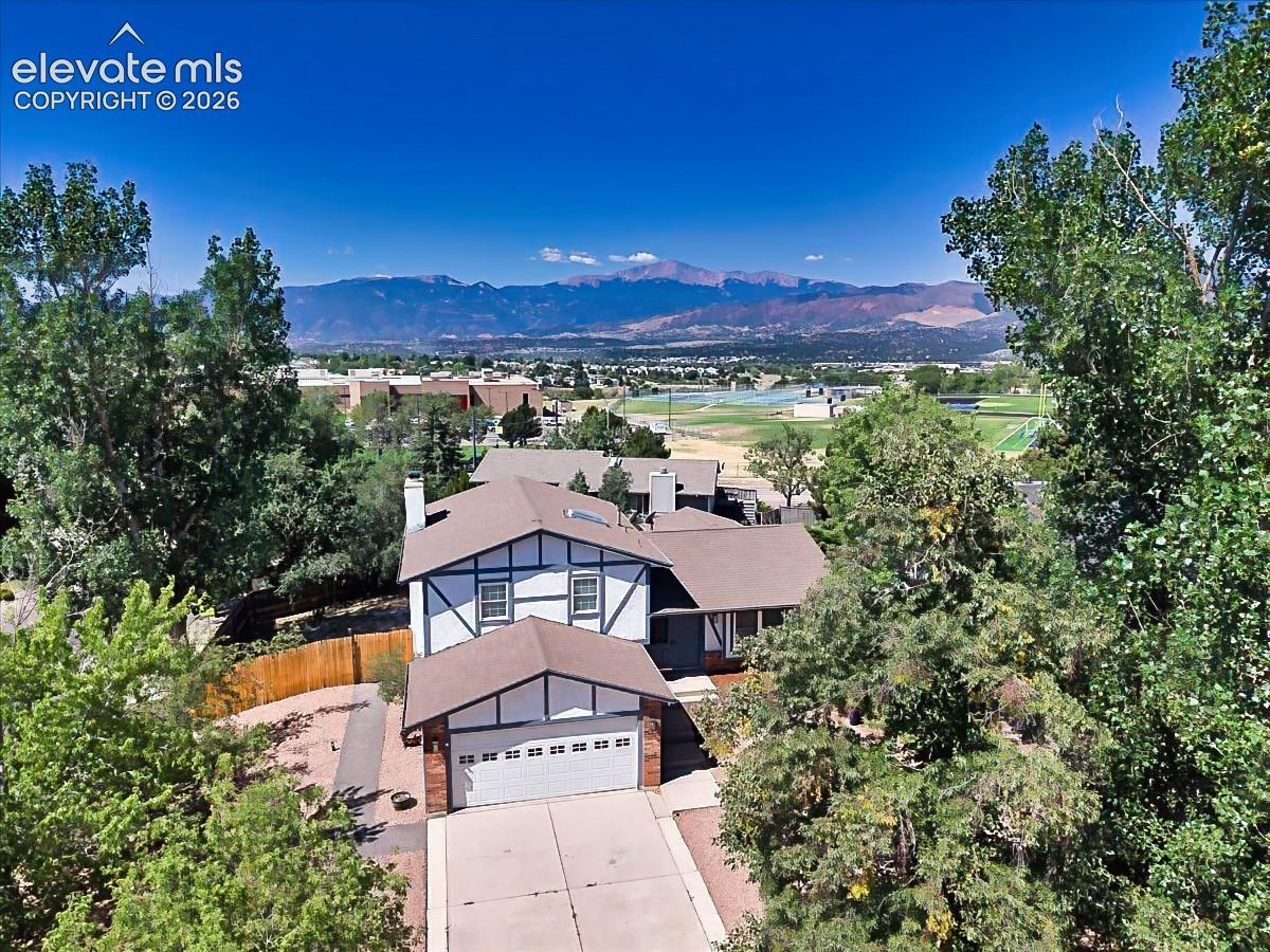 Elevated view showcasing the home's setting with sweeping Front Range mountain views and a convenient location within the surrounding neighborhood.