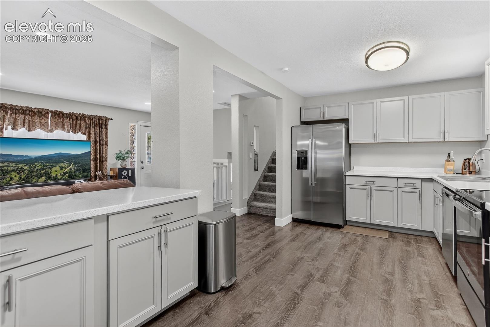 Hand-through window from living room to kitchen