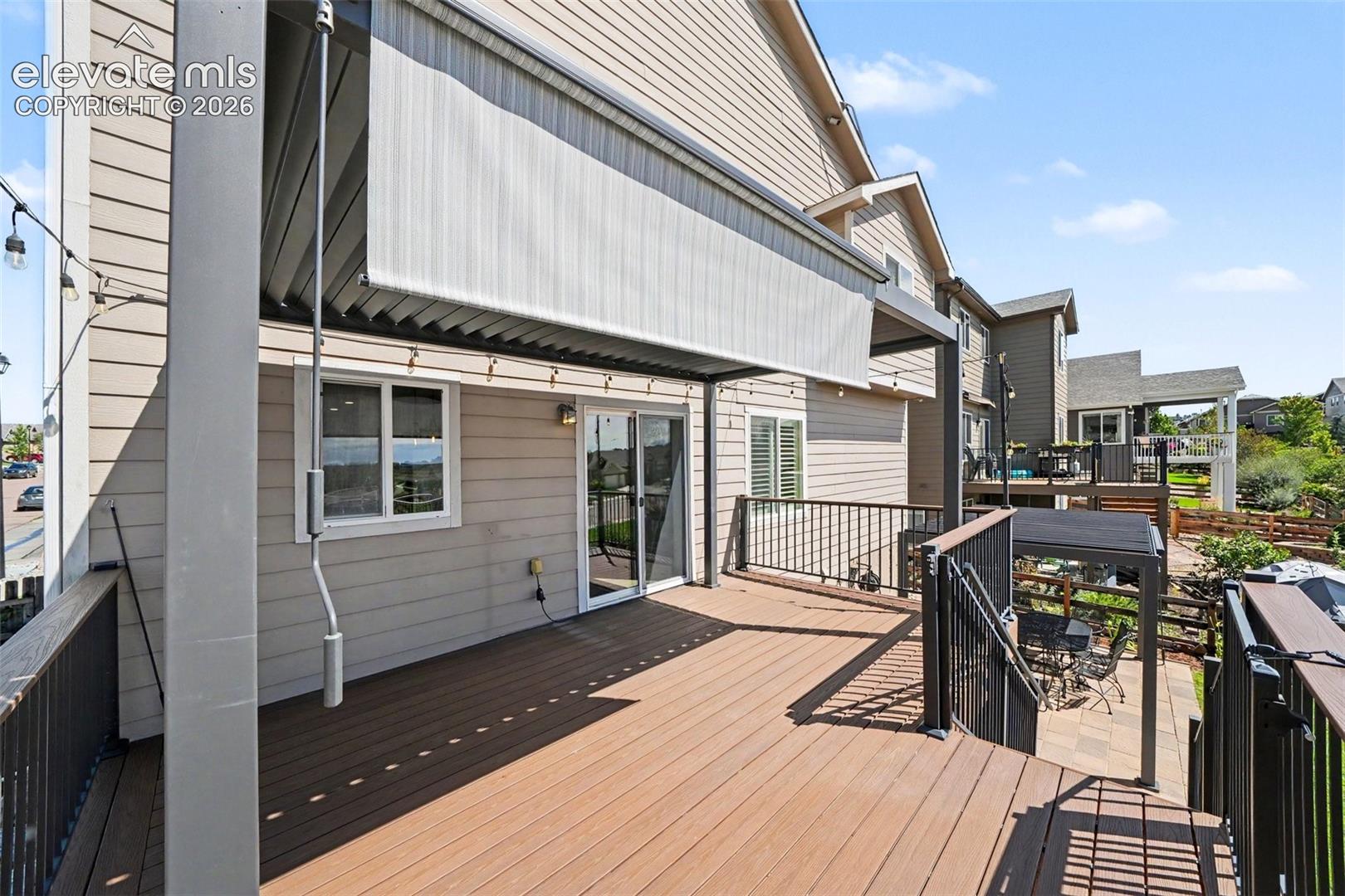 Large Composite Deck and Pergola with Retractable Shade and Adjustable Louvres