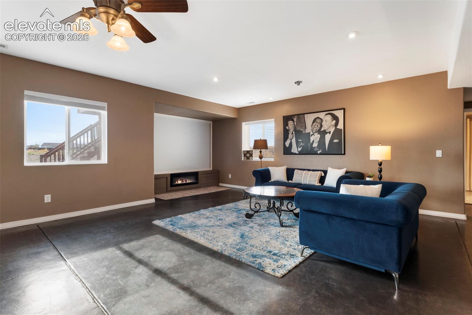 Basement Area has a Beautifully 
Stained Concrete Floor, Recessed Lighting, and  
Ceiling Fans