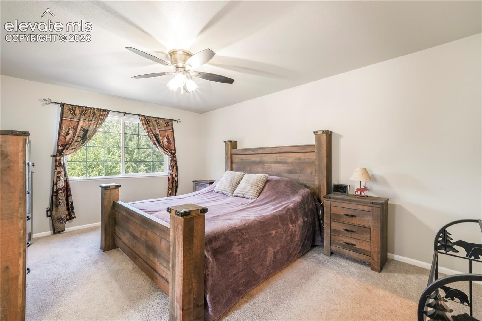 Upstairs Primary bedroom with views of Pikes Peak, 2 closets and updated bathroom