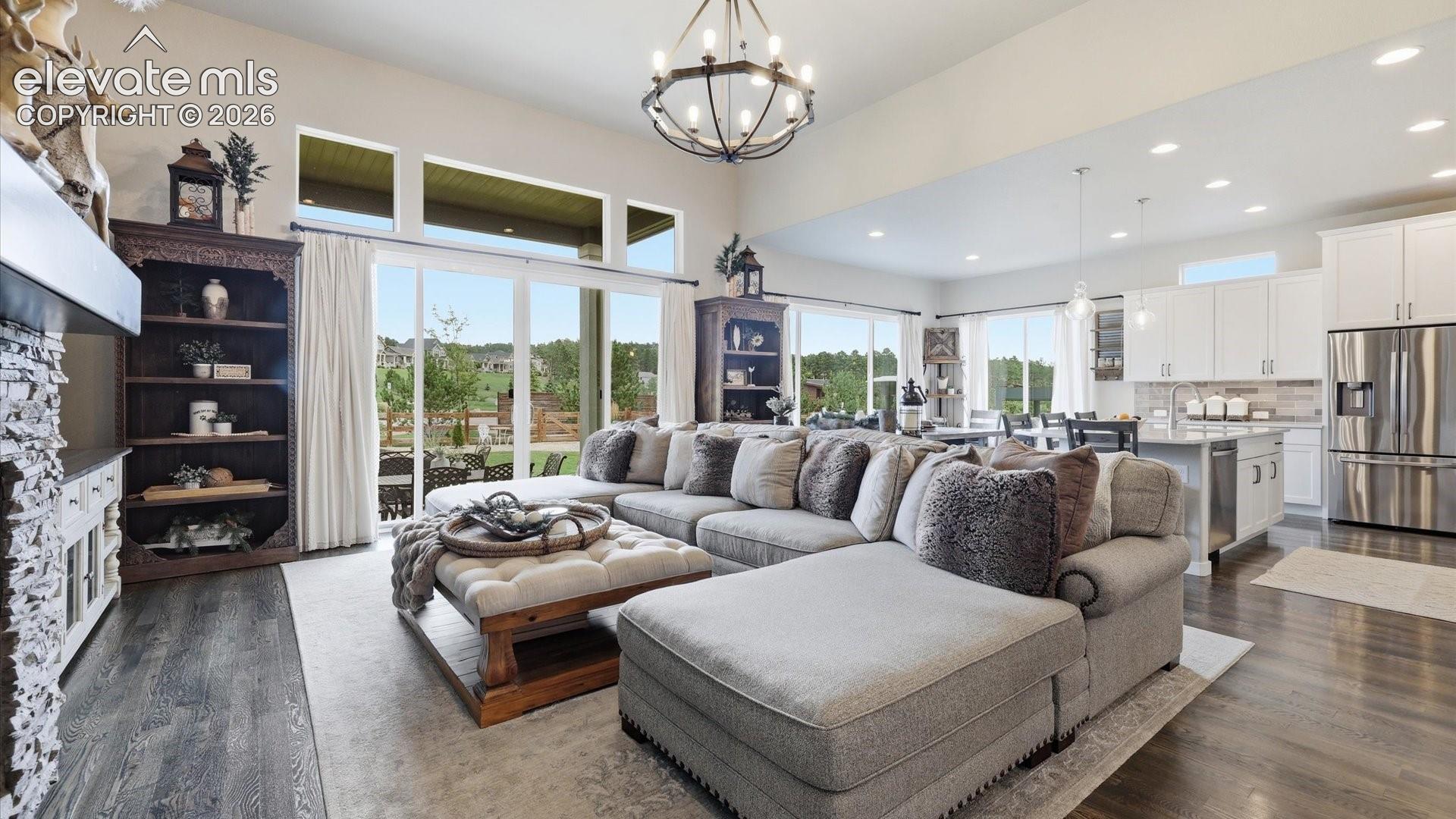 YOUR PERFECT COLORADO EVENING — Curl up and enjoy the warmth and ambiance of this beautifully designed living space.