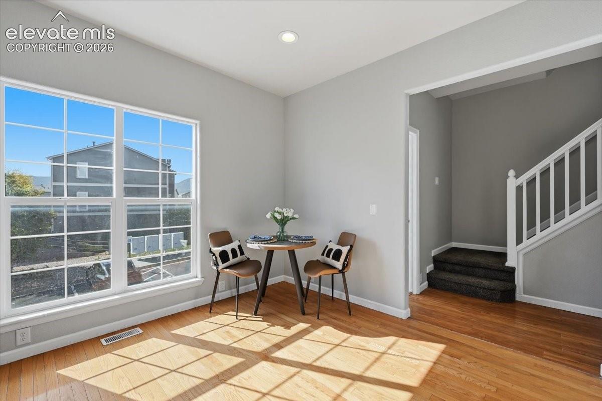 Cozy dining or coffee space in the kitchen. Hardwood flooring throughout, bright window with grid panes, recessed ceiling lighting, mountain views!