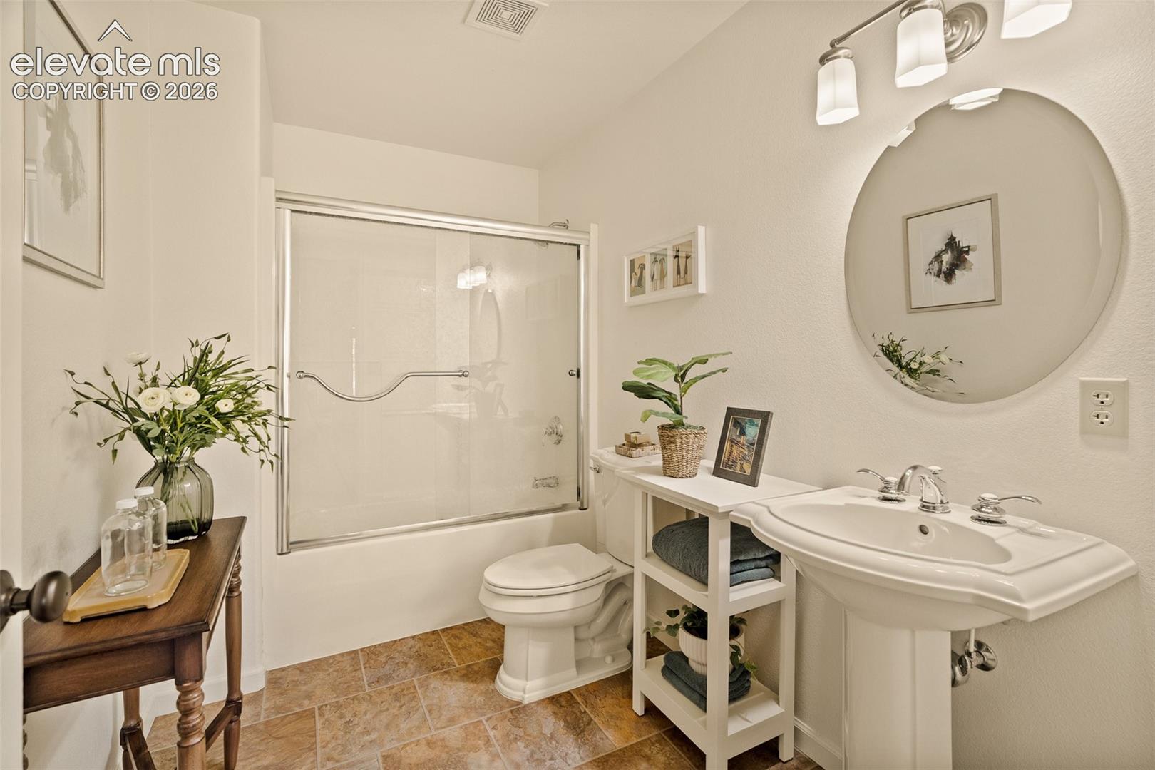 Basement primary bathroom en suite photographed June 2026