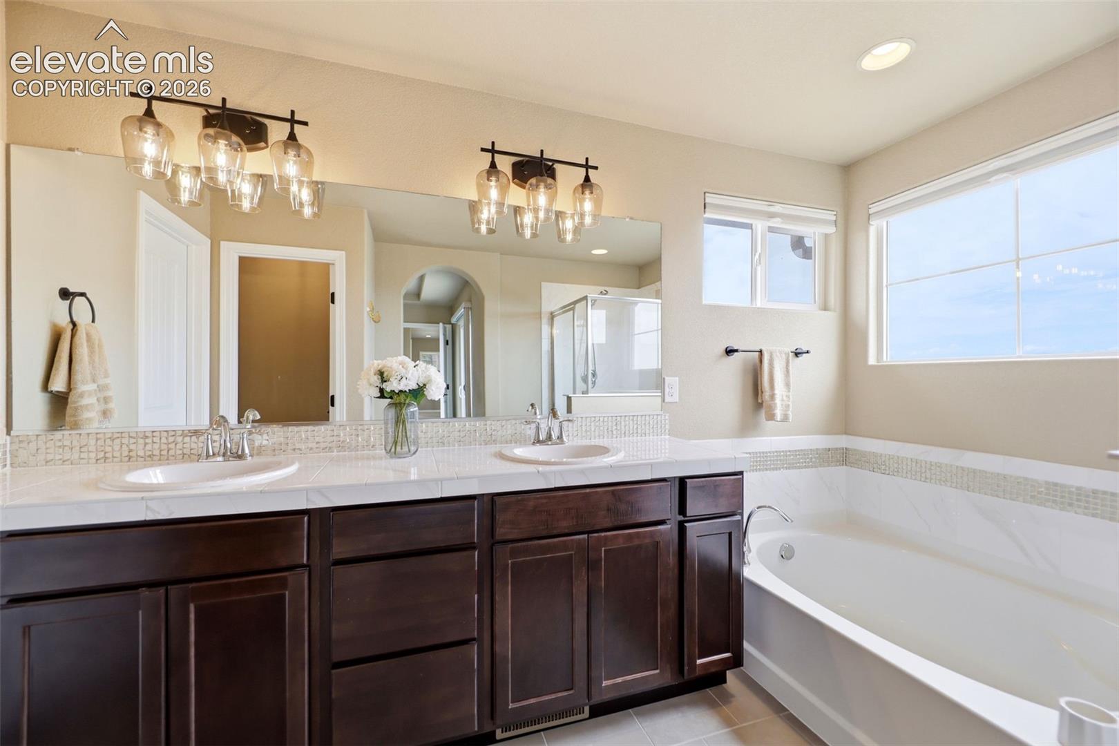 Five piece primary bath with tons of light