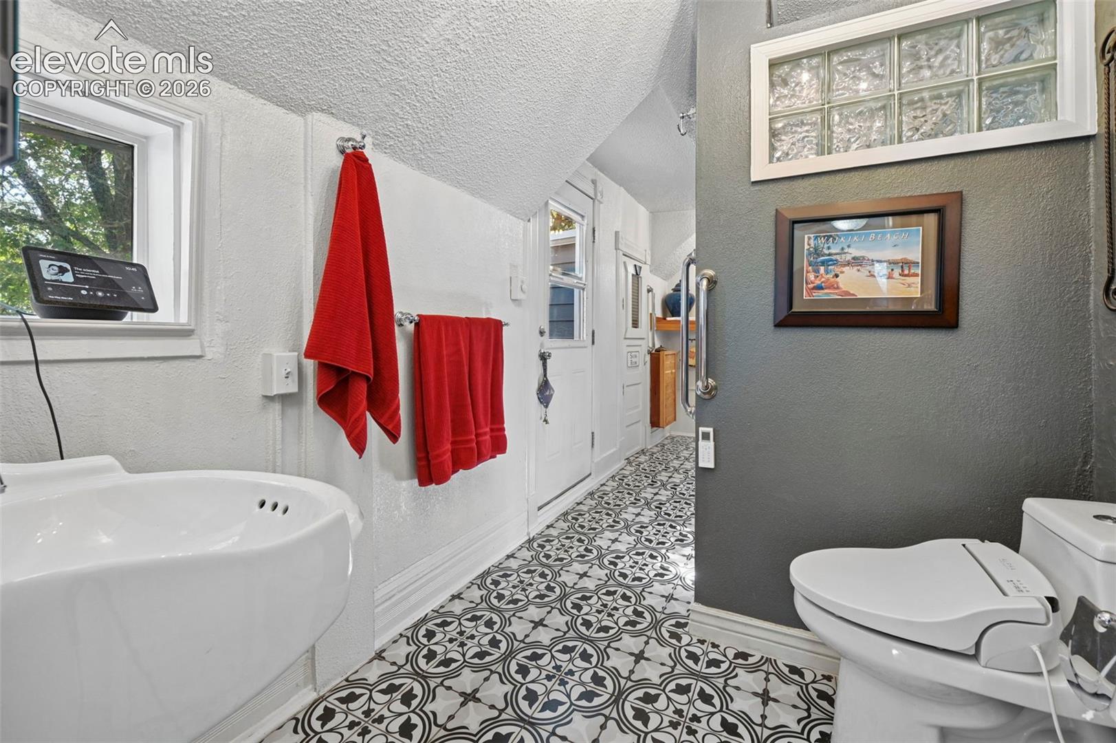 Primary Bath with Tile floors and walk out balcony