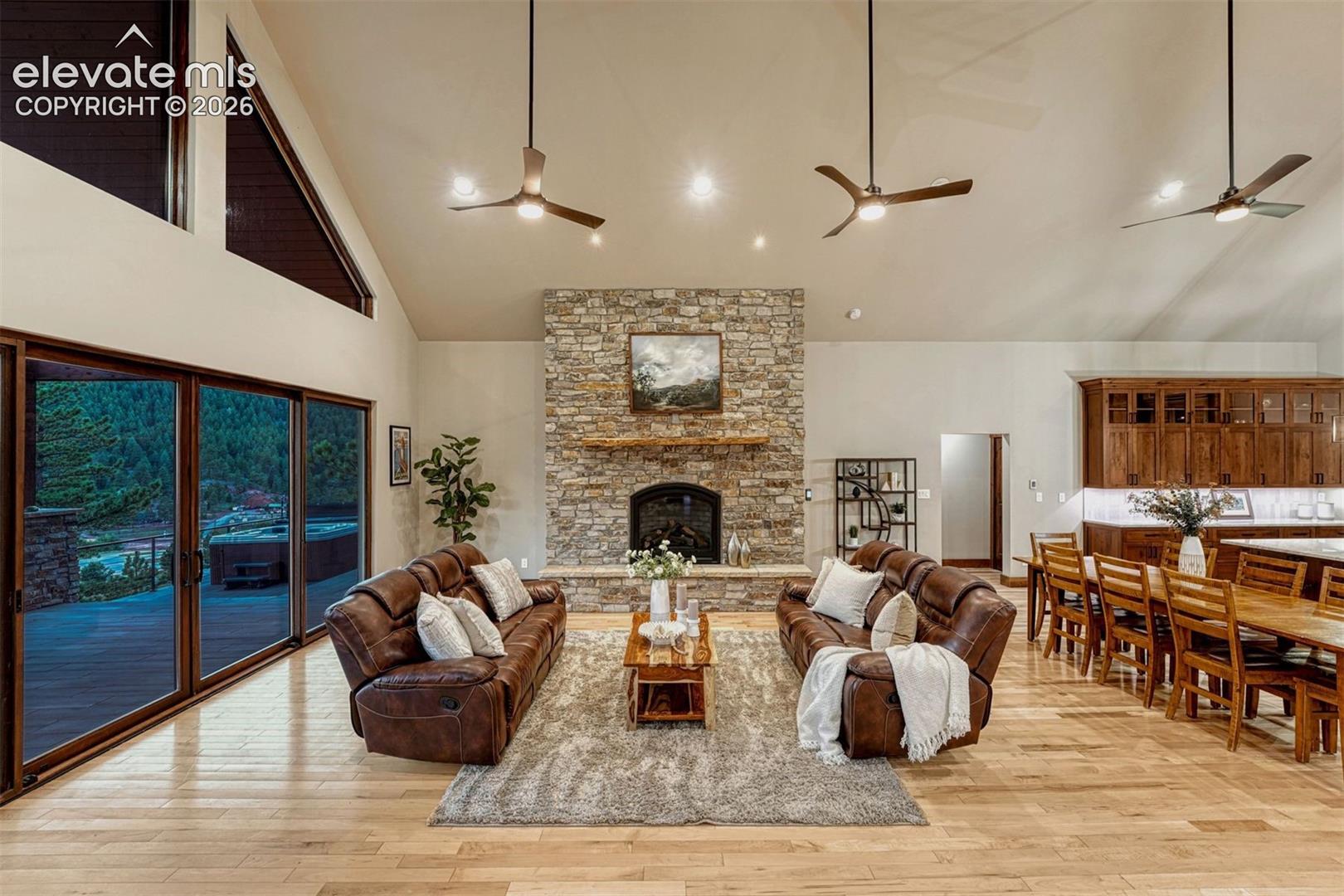 Spacious Open living with stone fireplace and Maple wood Floors