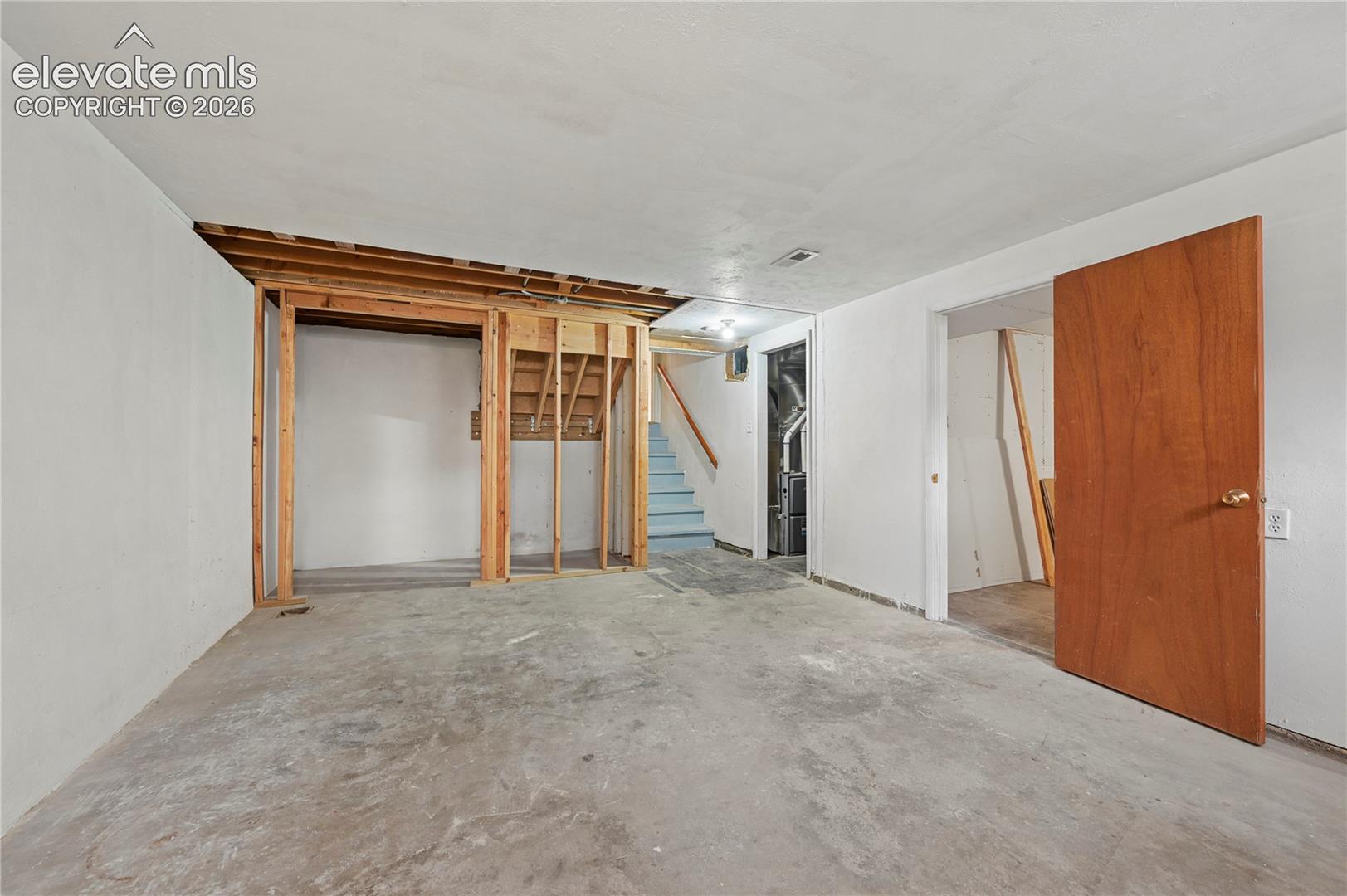 Basement Family Room (Looking Towards Bedroom, Mechanical Room & Stairs)