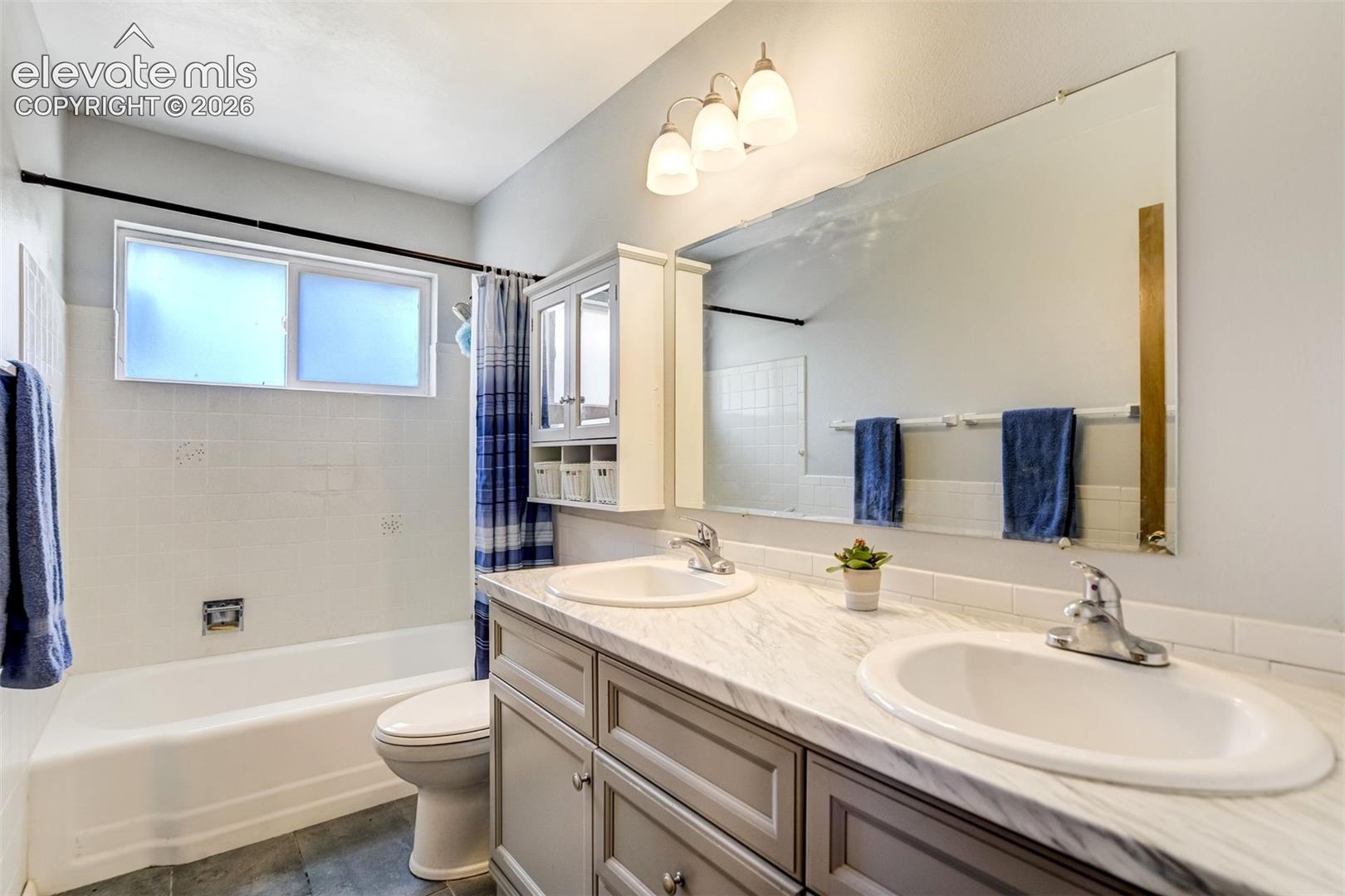 Updated dual vanity main level bath.