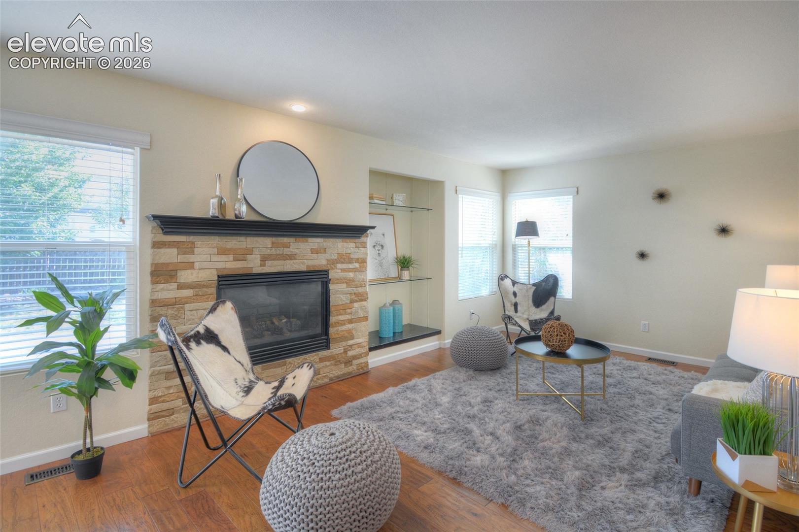 One of 2 family rooms! Main level family room has a gas fireplace, built in shelving and beautiful wood flooring.