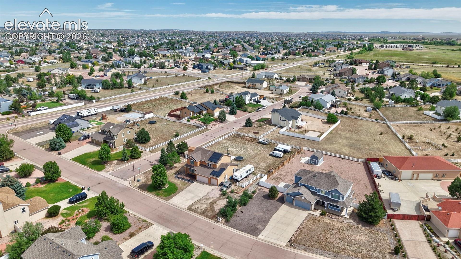 Expansive residential area featuring a variety of single-family homes, mature landscaping, and paved roads