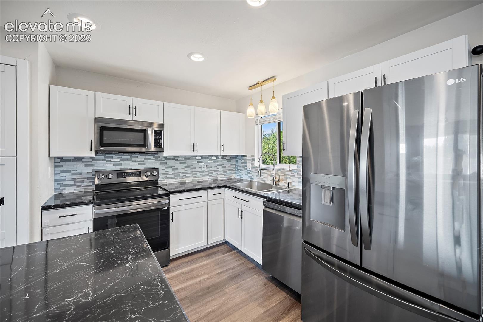Updated kitchen with stainless steel appliances.