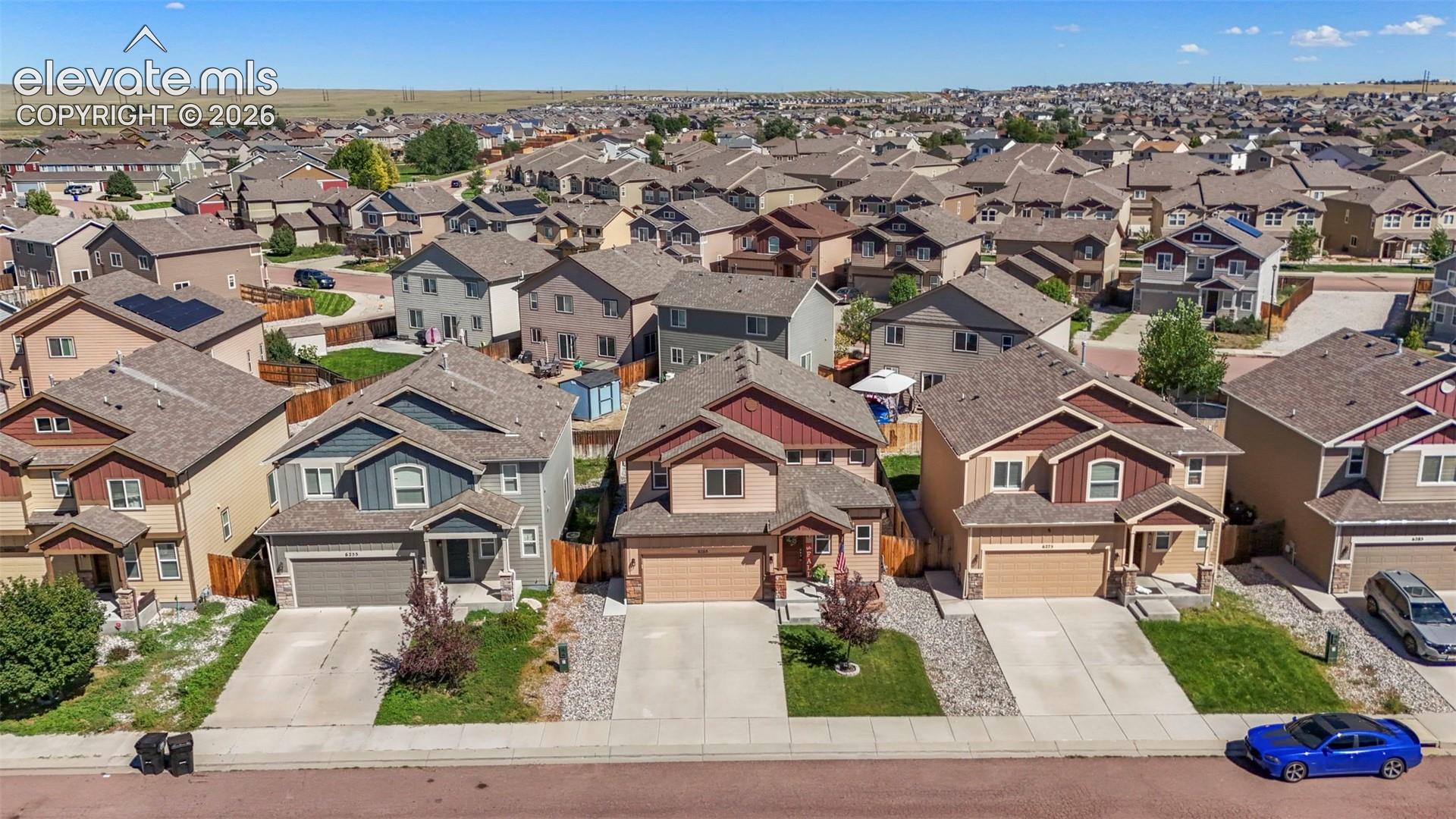 Suburban neighborhood with diverse architectural styles and attached garages