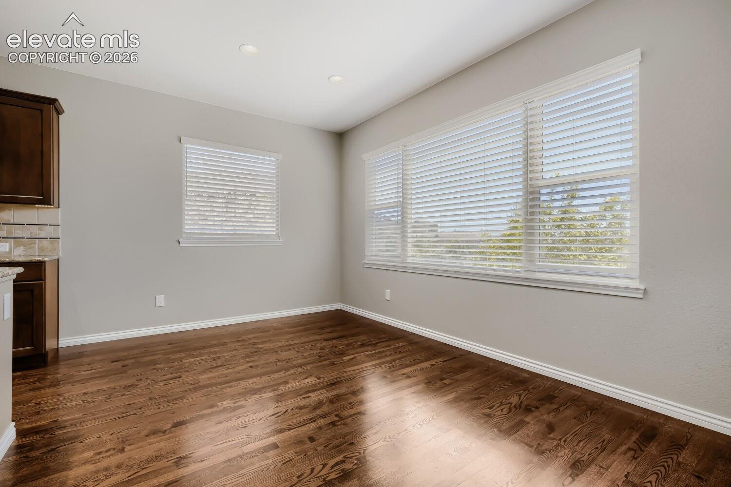 Beautiful dining room with spacious design, open concept floor plan, all out to deck and gorgeous wood floors.